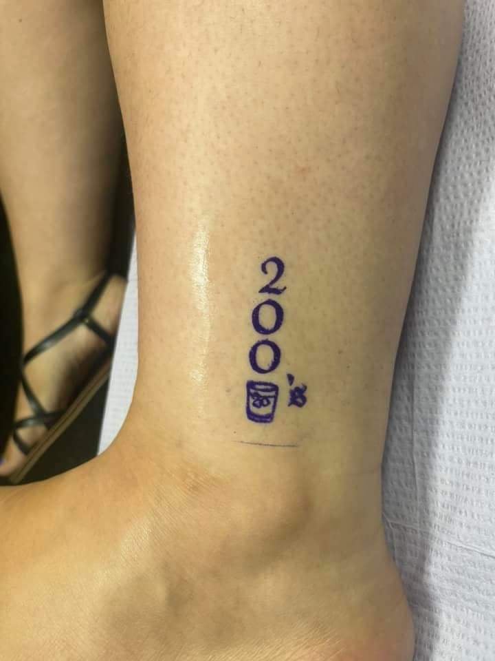 60 Original Tattoos on calf numbers 200 and a glass