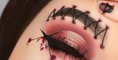 1 TOP 1 Maquillaje MakeUp Halloween Con agujas cruzadas en el costado del ojo sobra y delineador simulando sangre y cejas cosidas unas a juego 1