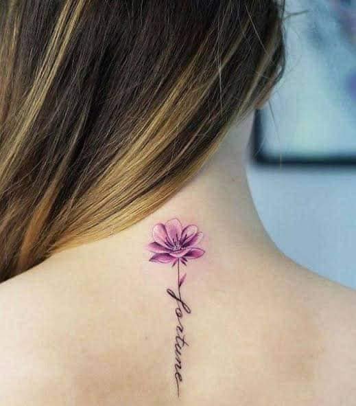 18 Female Tattoos Violet flower at the base of the neck with the word fortune fortune as a stem