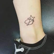 5 TOP 5 Tattoos mit dem Buchstaben D auf der Wade mit Stern