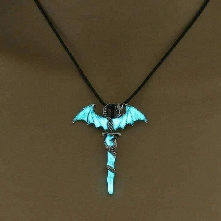 56 Pendant for Necklace in the shape of bat wings and light blue metal dagger that glow in the dark