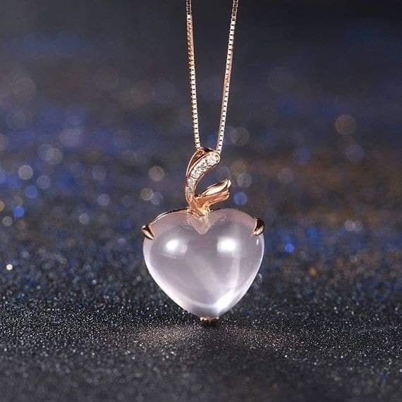 64 Translucent Sphere Pendant in the shape of a heart set by a fine gold chain