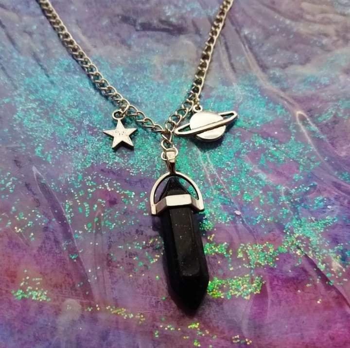 66 Black Curazzo crystal with steel chain with saturn and star