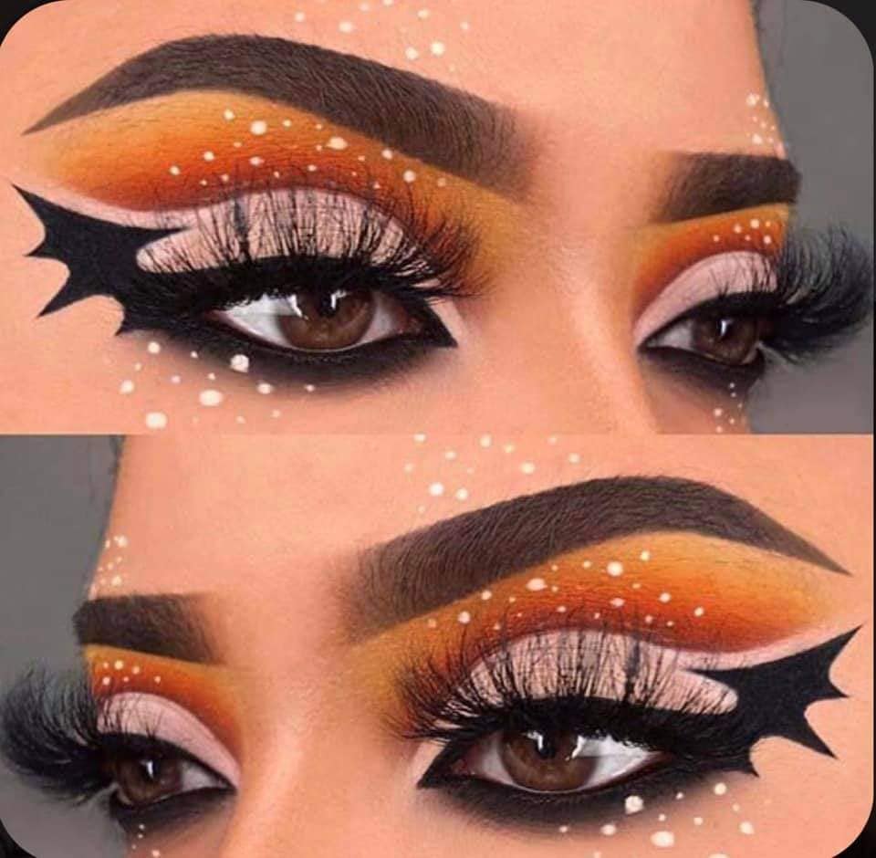 7 Halloween-Make-up, orangefarbene Augenbrauen, Augenkontur als formende Fledermausflügel, weiße Farben