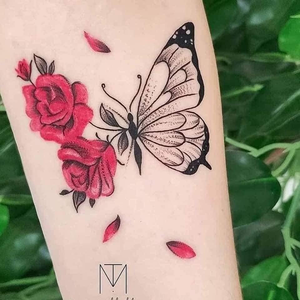 7 Female Tattoos Half Black Butterfly and Half Wings with Red Roses Petals on Forearm