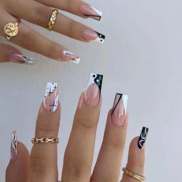 92 Black Nails with pink and white drawing of yin yang stars lines and curves