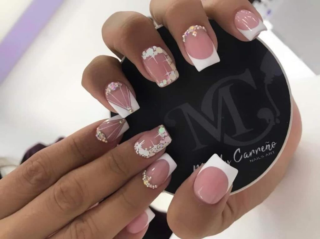 95 Nails with pink drawings with delicate rhinestones white tips white snowflakes