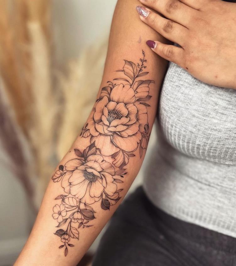 10 Chik Tattoo flowers leaves and twigs on forearm