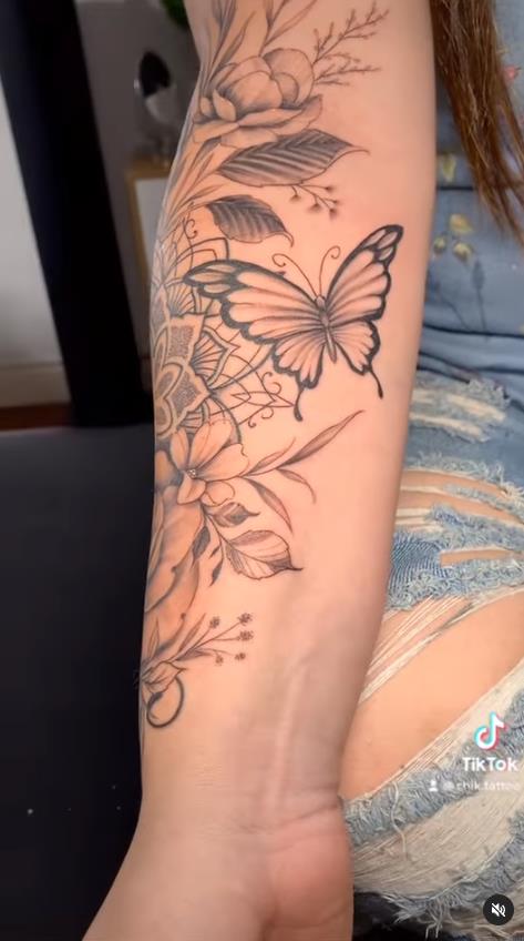 18 Chik Tattoo butterfly and nature on forearm