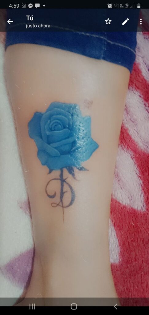 128 Most Liked Original Tattoos Pink Blue Flower with letter D on calf