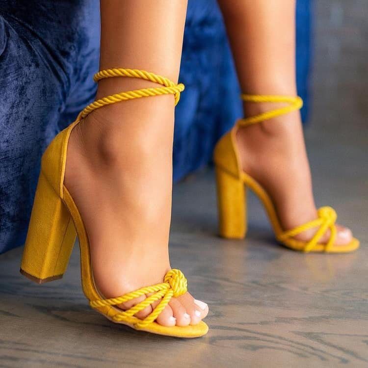 74 Yellow shoes with string heels at the ankle and on the fingers