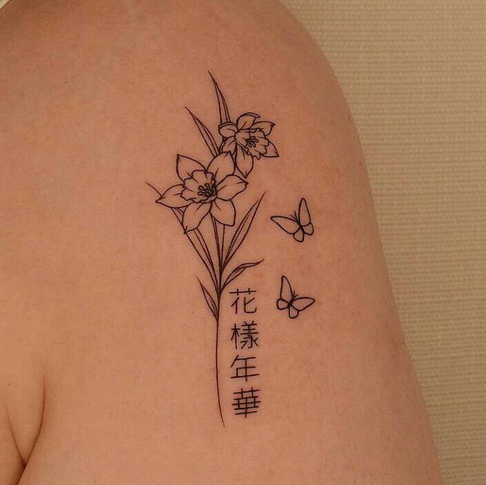 111 Simple Tattoos for Women Flowers on the arm with Chinese letters and butterflies