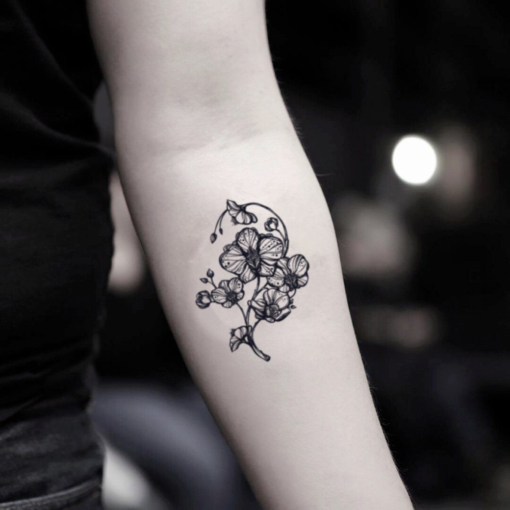 25 Beautiful and small orchid tattoo on the arm of a girl