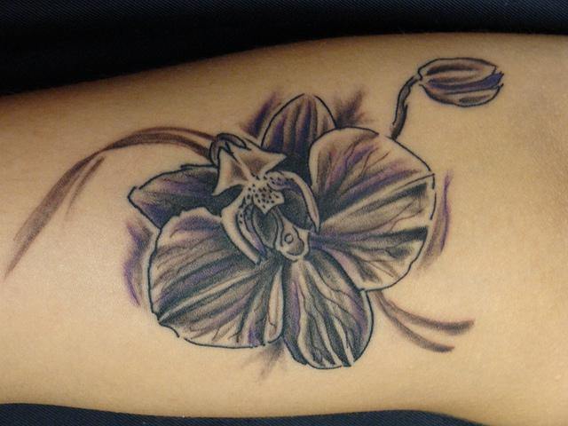 9 Beautiful orchid tattoo on the arm