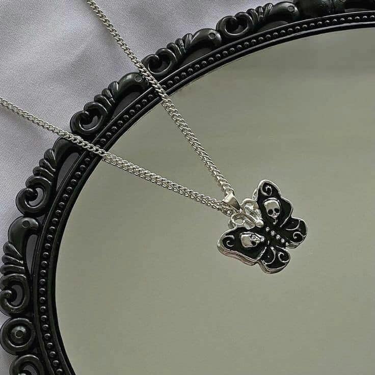 175 GOTHIC JEWELRY pendant in the shape of a butterfly with skulls and skeletons inside in black and silver