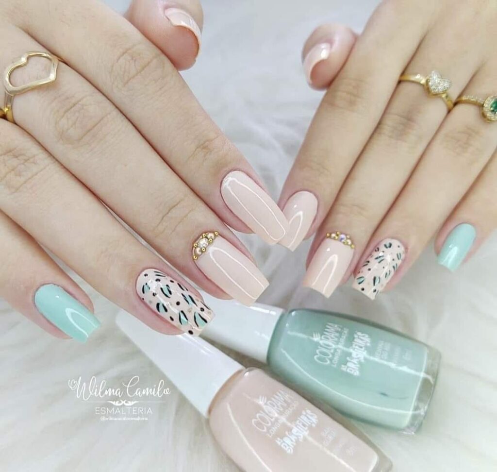 2068 Beautiful animal print nails in bright pale pink and turquoise with animal print on one
