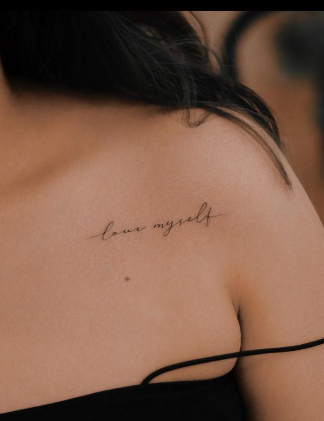 37 tattoo by the artist Nhi.ink of the word LOVE MYSELF in English which means I LOVE ME on the clavicle