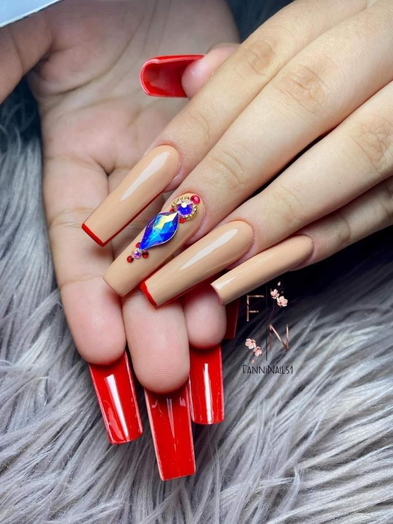 105 Extra-long square Double View nails with nude enamel and rhinestone detail and reverse of nails with intense red enamel