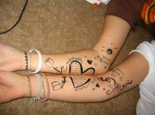 Beautiful complementary tattoo for couples of hearts, drawings and shapes