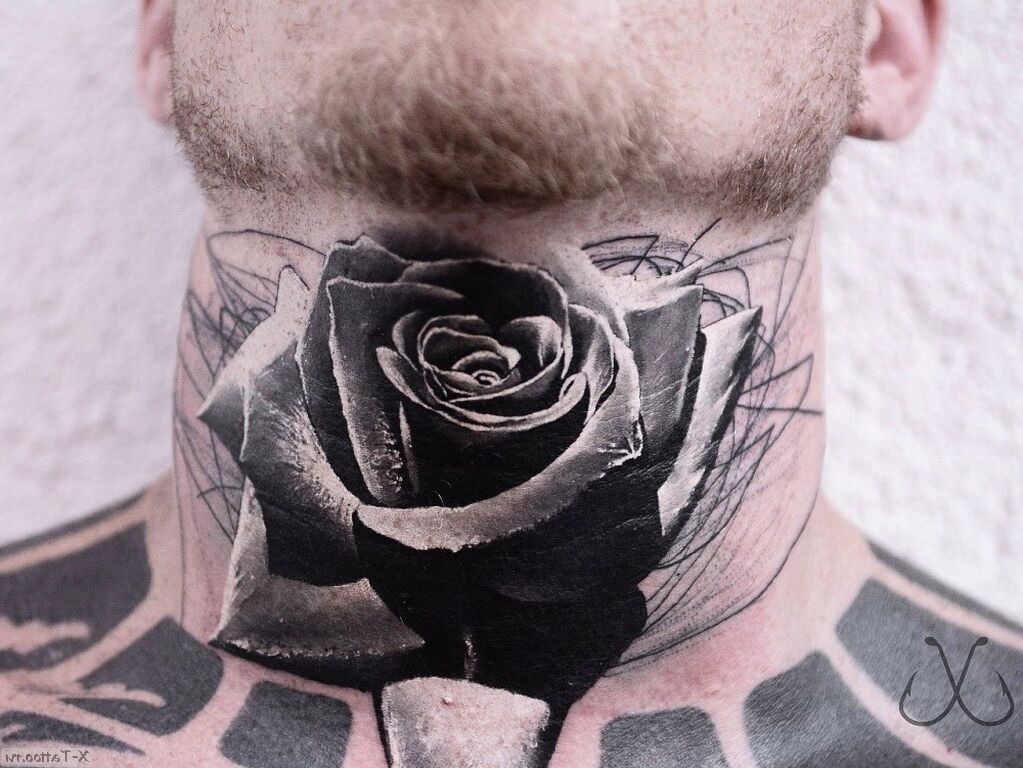 Black rose tattoo on neck under chin