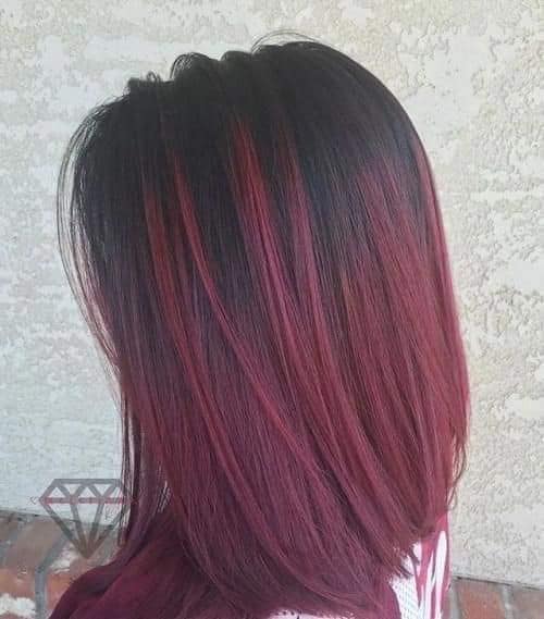 Short straight wine red hair black background