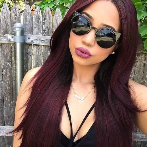 Medium length straight wine red hair to the breasts
