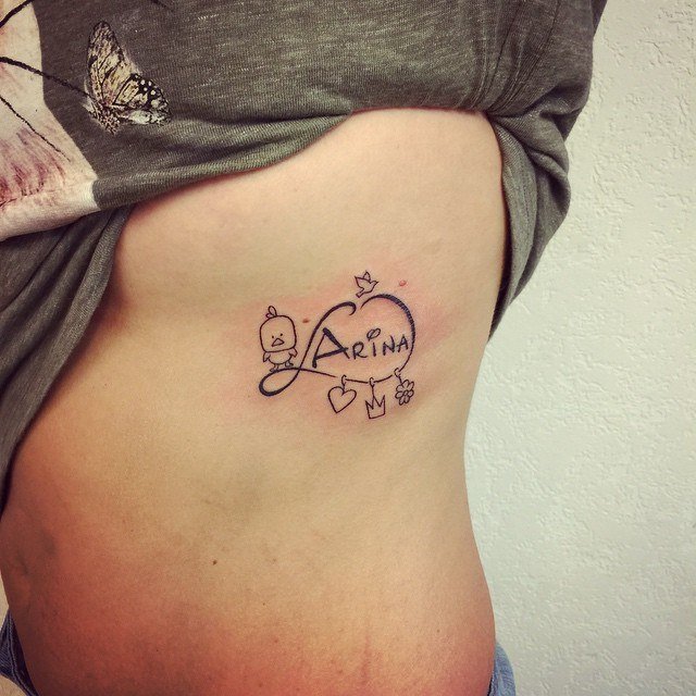 In Honor of our Children infinity on the side of the back in ribs with duckling and name Arina