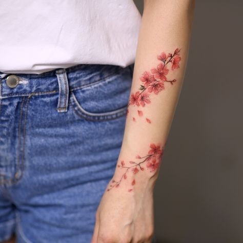 Red flowers and branches on woman's forearm bracelet type 12