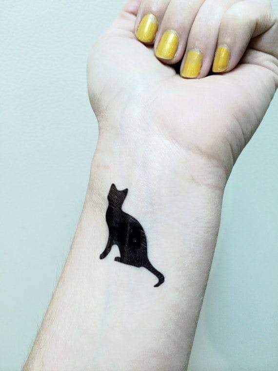 The best tattoos of black cats on the wrist