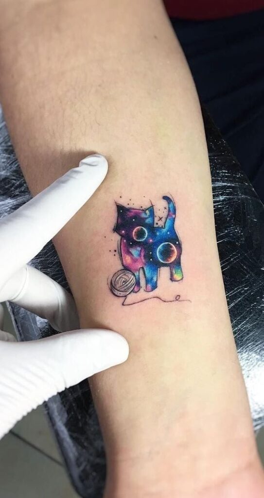The best posterized space type cat tattoos with planets and colors and ball of wool