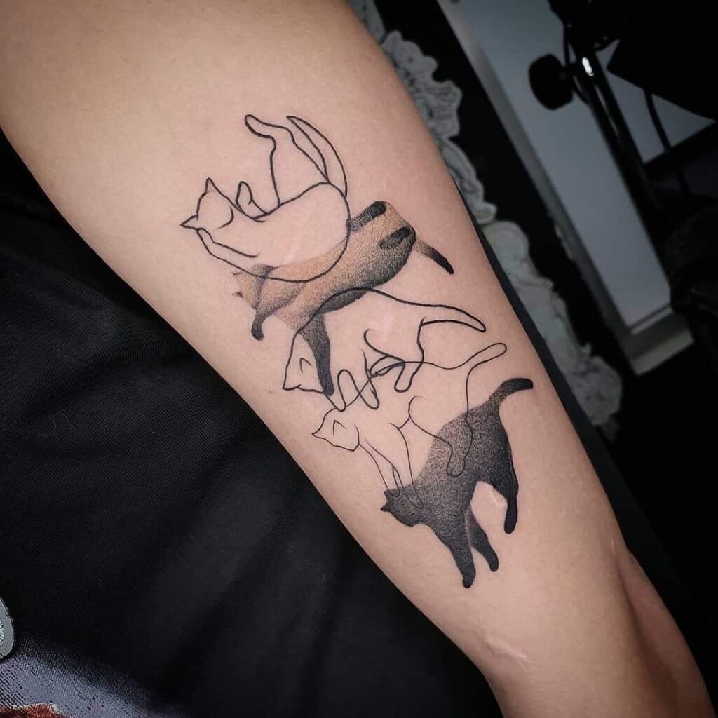 The best cat tattoos representation of the fall and flip of a cat in the air