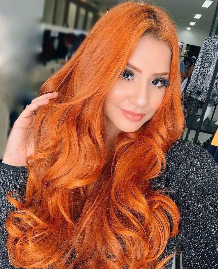 Copper-colored hair, very long and bright wavy hair
