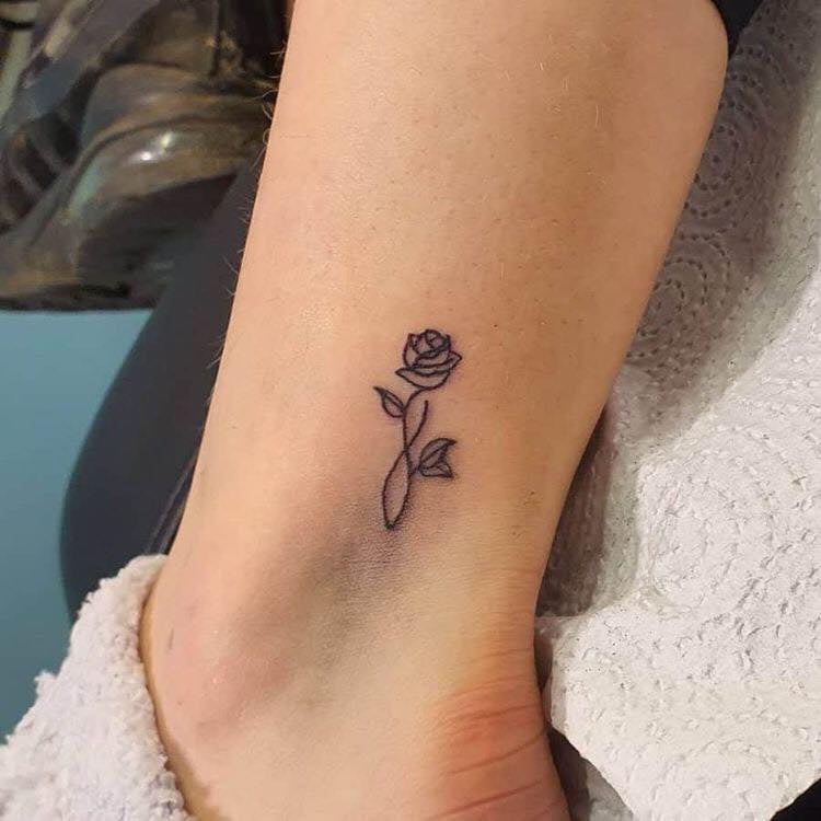 Small rose tattoo on calf 70