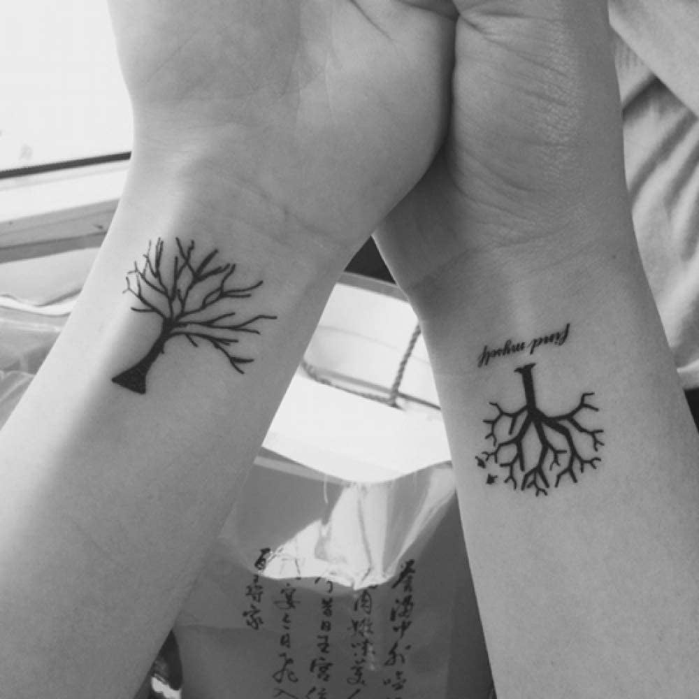 Tree of Life tattoo in couples on wrists one inverted