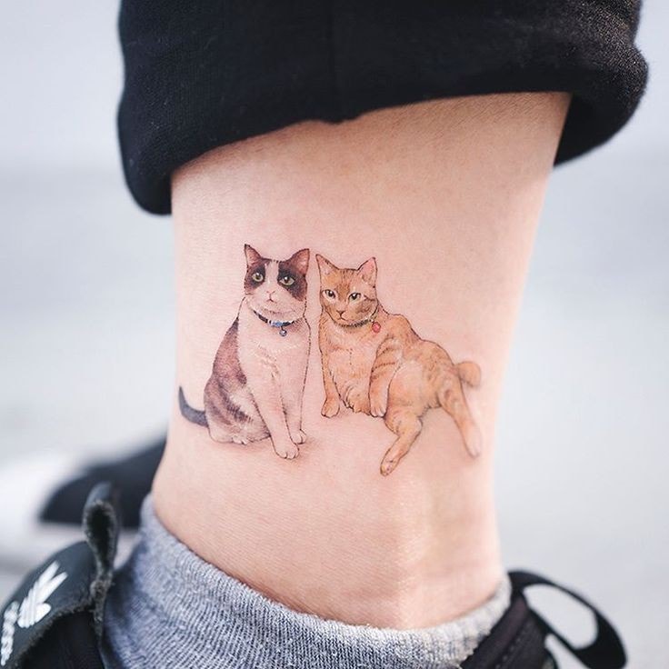 tatuagem de gato na panturrilha