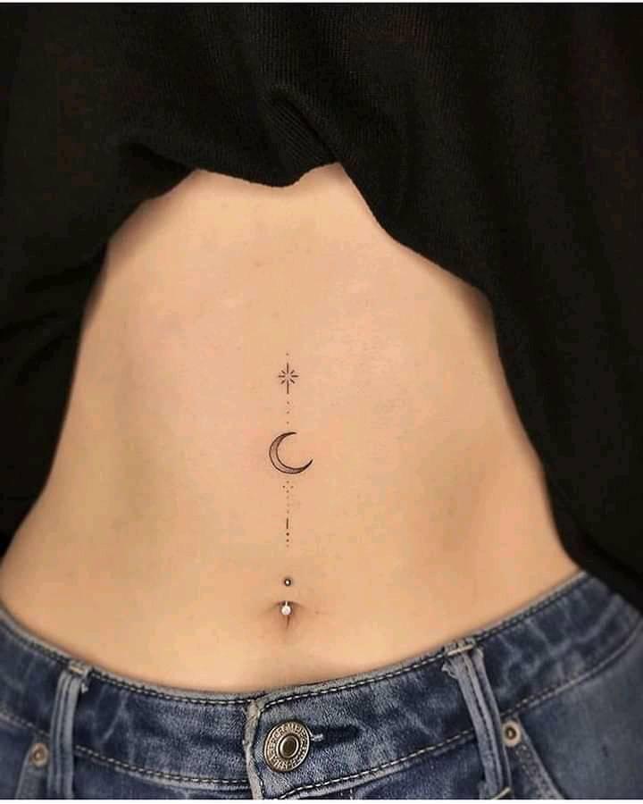 Moon tattoo from the navel