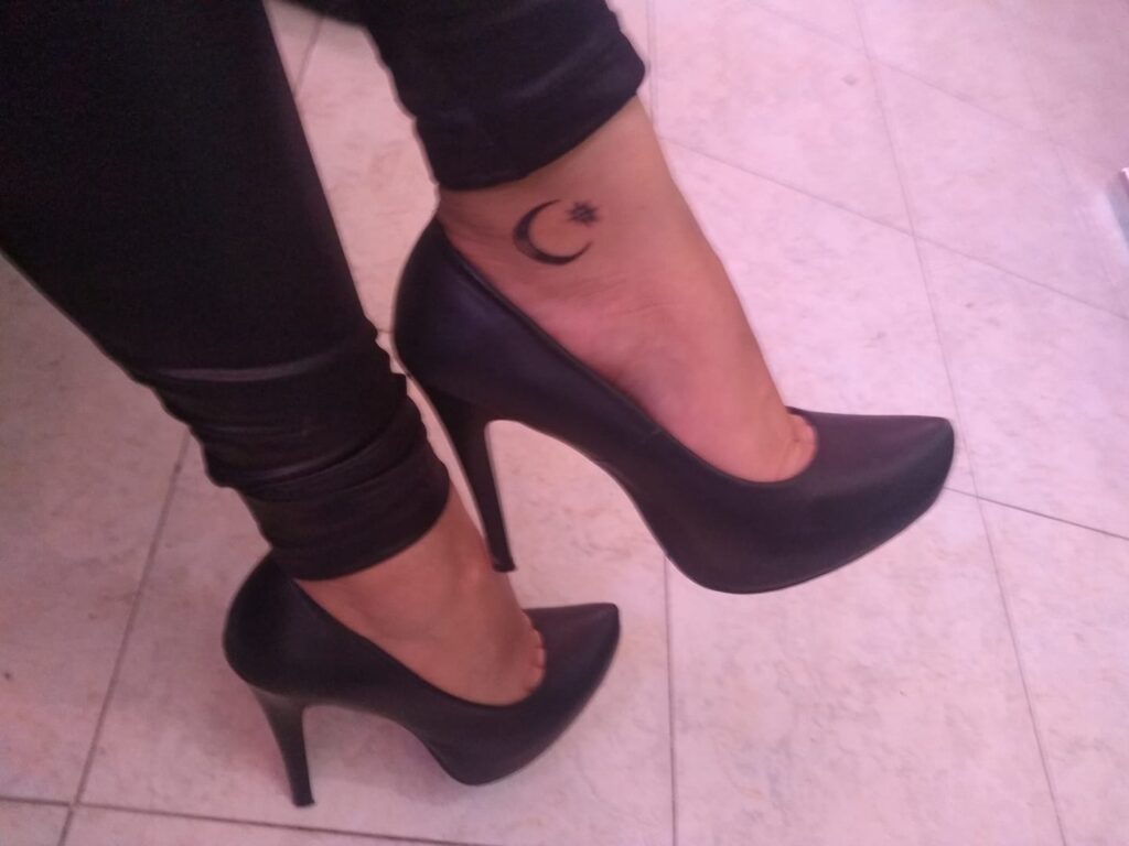 Moon tattoo on foot with star