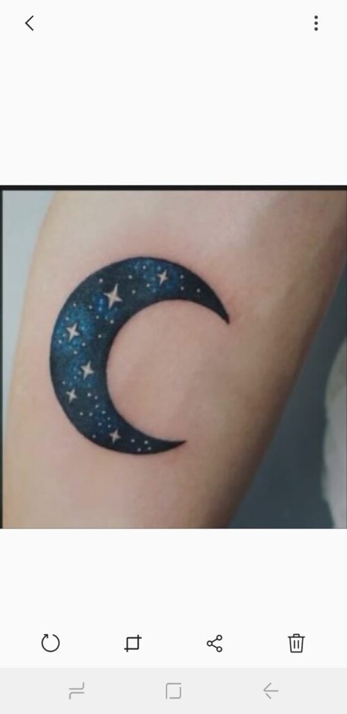 Moon tattoo painted with stars