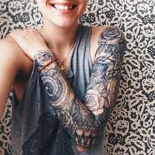 Circular geometric patterns sleeve tattoo