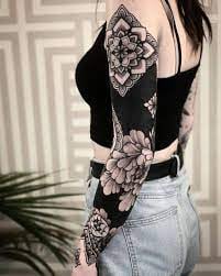 Sleeve Tattoo Geometric Patterns and Large Roses