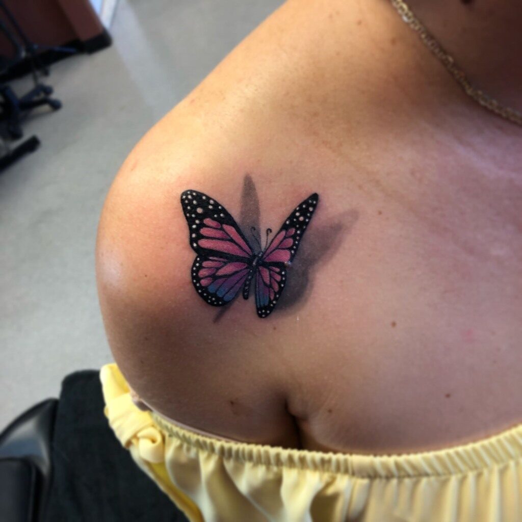 3D Butterfly tattoo on purple and blue shoulder
