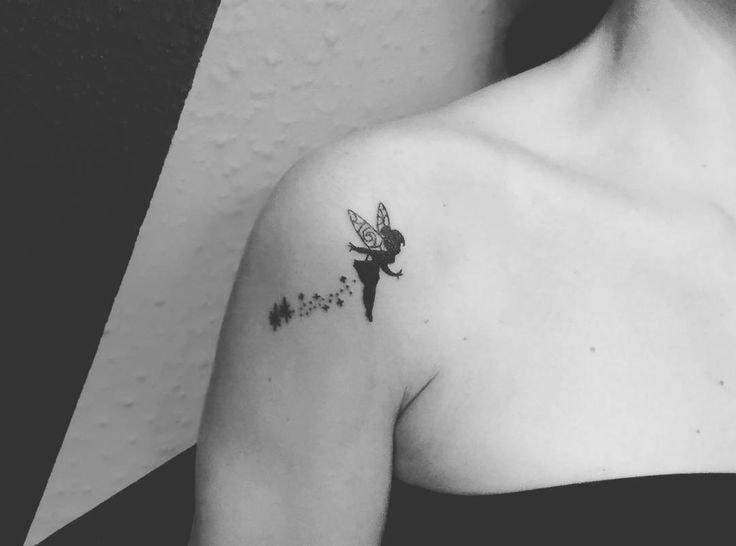 Fairy tattoo on shoulder blade