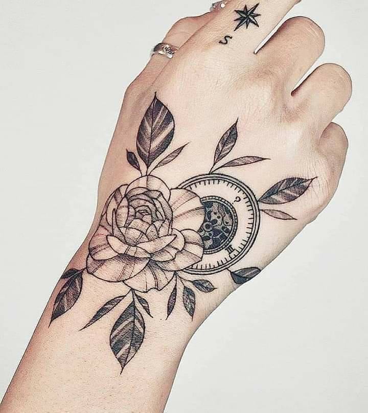 Wind rose and normal rose tattoo on hand