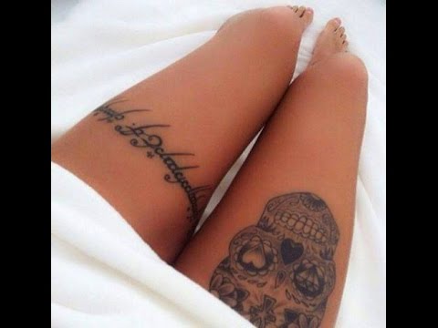 Tatuaje en Muslo de Mujer en ambos catrina de un lado incripcion del Otro