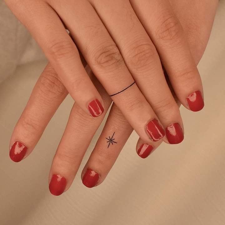 Fine line ring and star tattoo on fingers on both hands