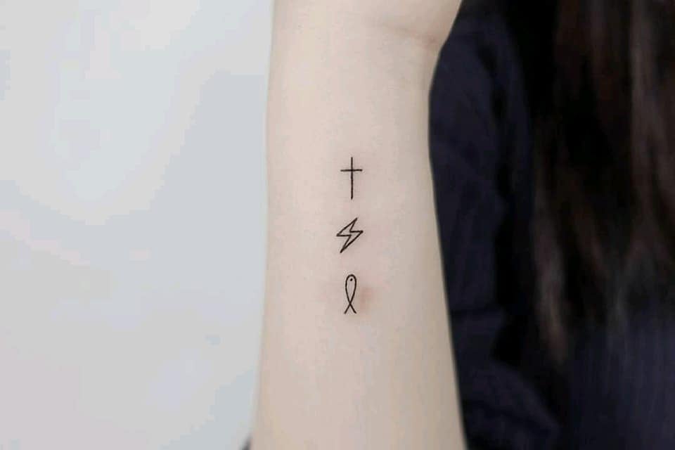 Aesthetic Tattoos Beautiful small minimalist Cross Lightning and fish on wrist