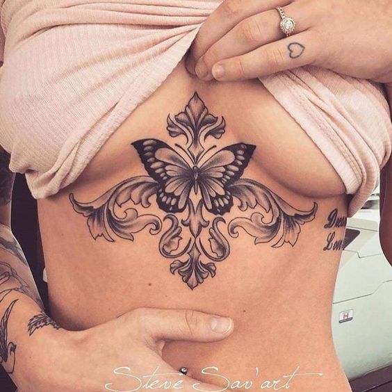 Tattoos Art Beauty Ideas Large Moth Butterfly and ornaments below the breasts