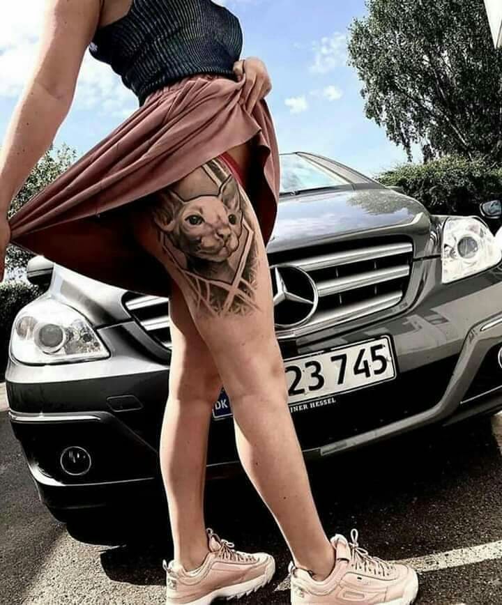 Beautiful Woman Dog Tattoos on Thigh