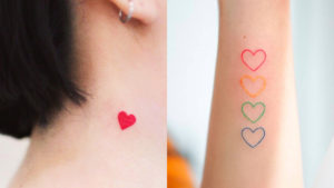 Bellissimi piccoli tatuaggi per donne, quattro cuori di diversi colori sul braccio