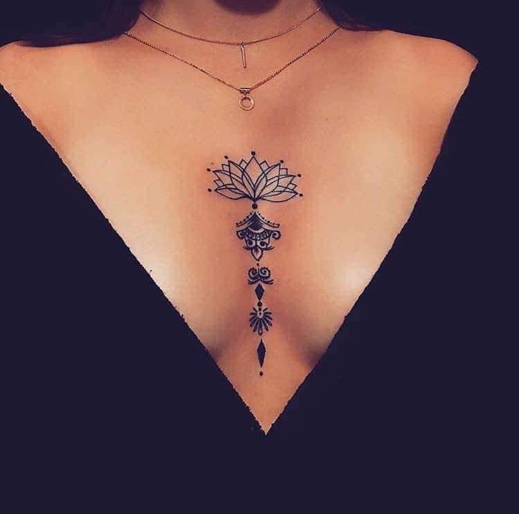 Beautiful and Sexy Tattoos for Women Lotus Flower between the breasts